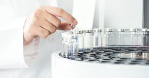 Scientist operating a centrifuge