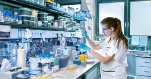 Scientist at bench pipetting