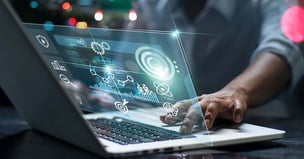 Photo of finance person on laptop computer, doing procurement