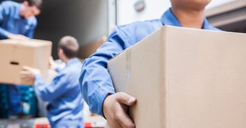 Lab relocation crew carrying boxes