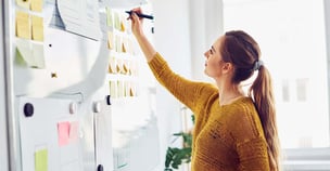 Photo of woman mapping out plans for incubator