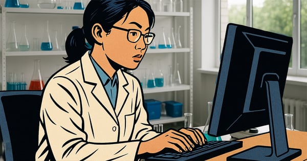 scientist at computer in lab ordering supplies