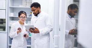 Photo of scientists looking at supplies