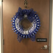 Wreath made of sample tubes, hanging on office door