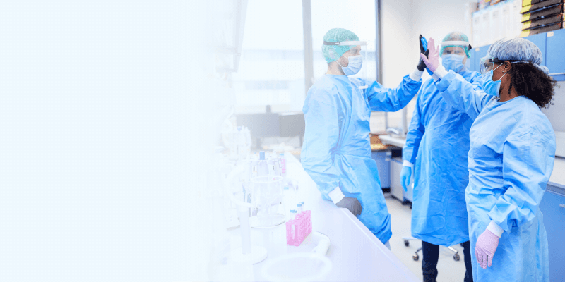 scientist giving a high five to one another